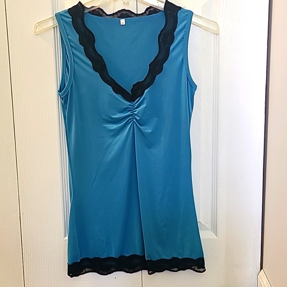 Womens size small tank camisole. Super cute tealish blue color. NWOT never worn.